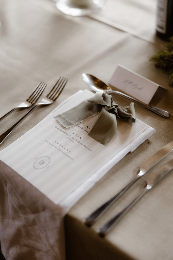 stripe menu with satin green bow